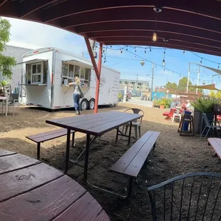 picnic tables and a food truck