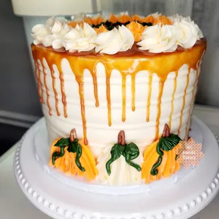 a cake decorated with caramel and pumpkins