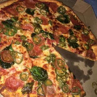 Pepperoni, spinach, and jalapeño pizza