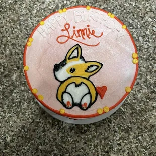 a cake with a dog on it