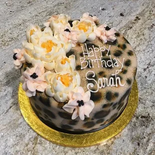a leopard print birthday cake