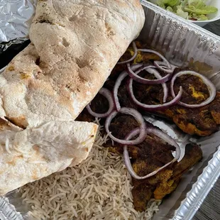 a whole chicken platter with rice