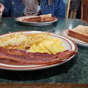 Large ,1 egg bacon hash rooms toast.