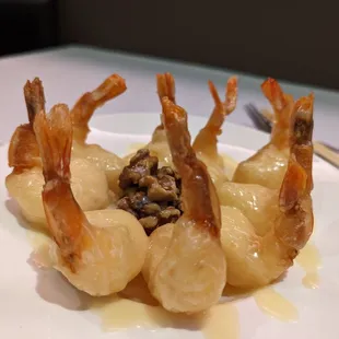 a plate of shrimp with sauce