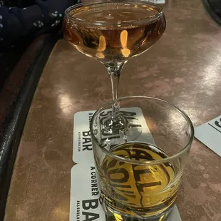 a glass of alcohol on a table