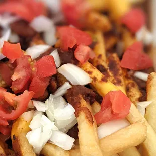 Chili Cheese Fries, we added the tomatoes and onion at home