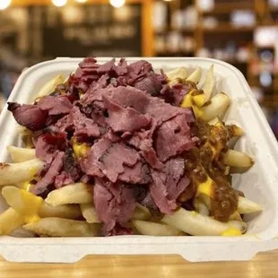 corned beef fries in a styrofoam container