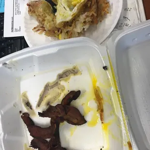 bacon and eggs in a styrofoam container