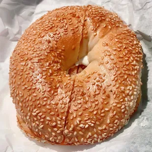 Sesame Bagel with cream cheese + tomato