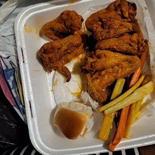 chicken and vegetables in a styrofoam container