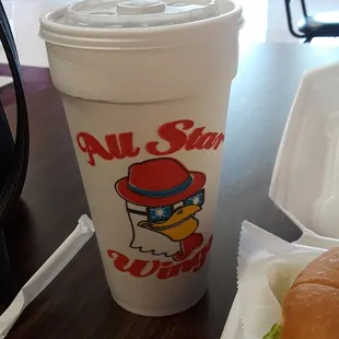 a cup of coffee and a sandwich