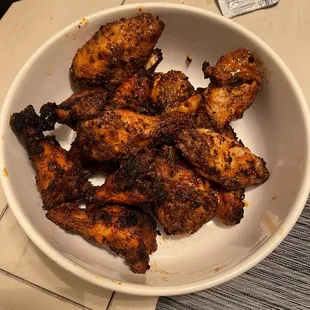 a bowl of chicken wings