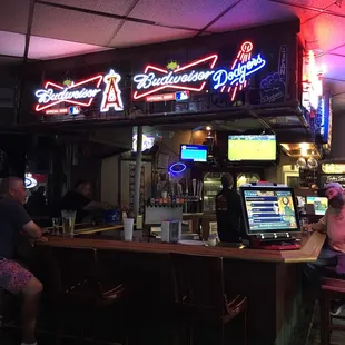 customers sitting at the bar