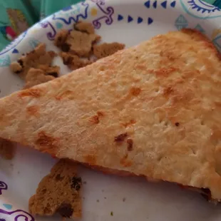 a piece of pizza on a paper plate