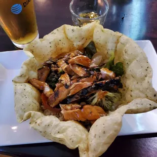 Unique and yummy.  Teriyaki chicken and price in a tortilla bowl