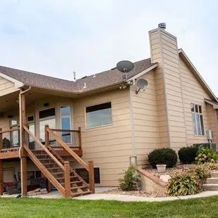 a house with stairs leading up to the second story