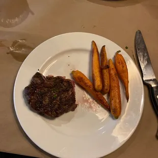 We split the ribeye. I chose carrots- he chose Mac &amp; cheese.