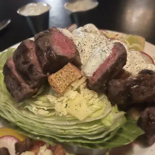 This is wedge salad with filet mignon with Gorgonzola, it's wonderful.  Single sit at bar!