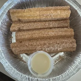 Churros with condensed milk