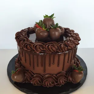 a chocolate cake with strawberries on top