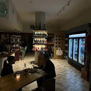 people sitting at a table in a restaurant