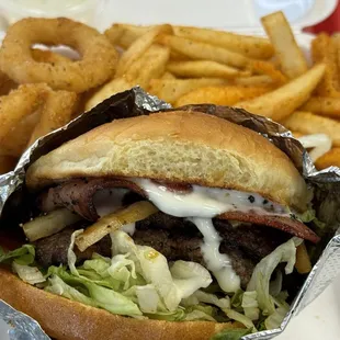 Smash burger with turkey bacon, onion ring and fries