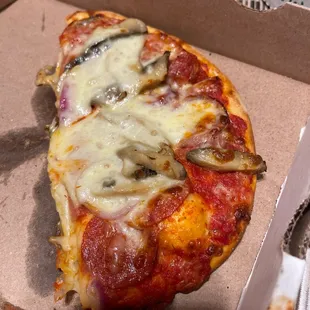 a slice of pizza in a box