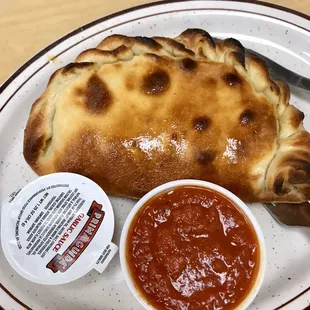 Calzone (our filling was mushroom, Italian chicken, and tomato)