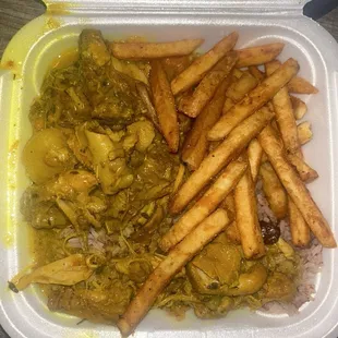 Curry chicken with rice &amp; peas and fries