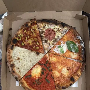 The Sampler (top clockwise: sweet sausage, stracciatella, cheese, spicy margh, cacio e pepe, pep &amp; pepp)