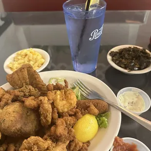 Fried seafood platter with collards and Mac and cheese