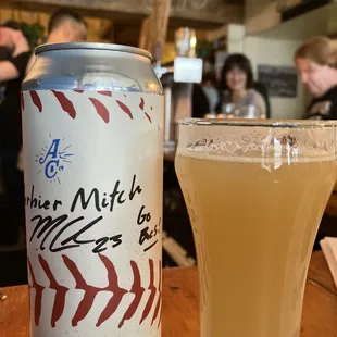 a can of beer and a glass of beer