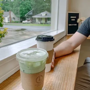 Medium iced matcha latte with coconut, salted caramel macchiato