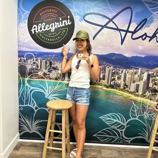 A young Japanese woman enjoying Caffe' Illy