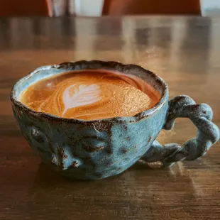 Latte featured in a locally made ceramic mug.