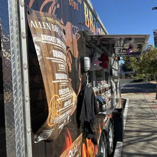 a food truck parked on the side of the road