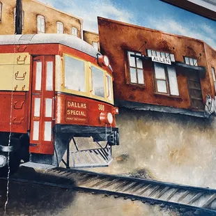 a painting of a train on the wall