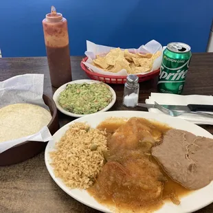 Huevos Rancheros plus side of Guacamole And Chips.