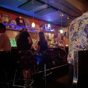 people sitting at the bar