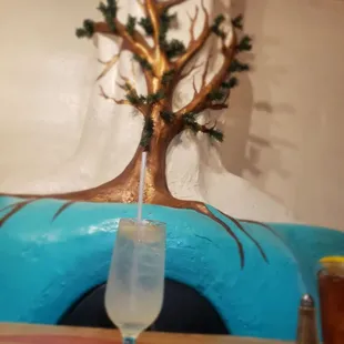 a glass of water and a tree