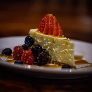 a slice of cheesecake with berries