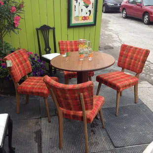 Refurbished set of table and chairs featured outside.