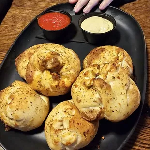 Pizza roll chubs served with Marinara and beer cheese.