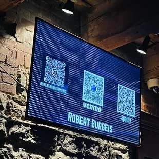 a large screen with qr code on it