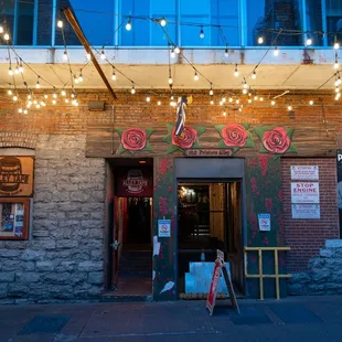 a brick building with string lights