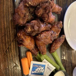 Mamasaki dry rub wings and zesty Asian wings plate