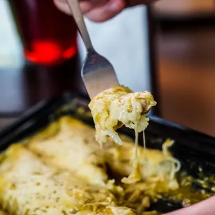 Enchiladas verdes  very tender smothered in cheese and salsa