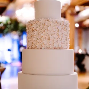 a three tiered white wedding cake