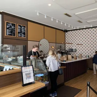 a woman standing at the counter