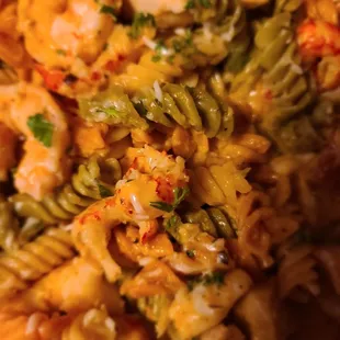 a pasta dish with shrimp and vegetables